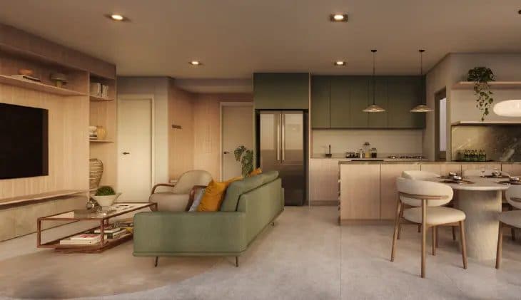 Sala de estar e jantar integrada com sofá verde, mesa de jantar e estante de madeira.
